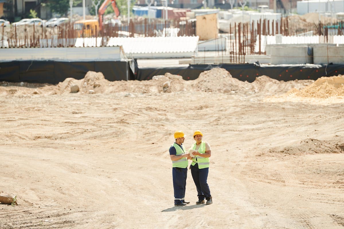 Safety consultant reviewing plans with a construction team